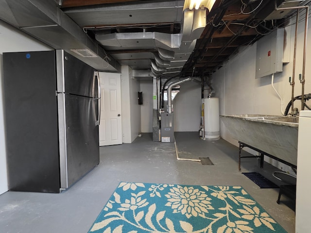 1516 W Webster Rd, Royal Oak, MI 48073 - unfinished basement featuring freestanding refrigerator, water heater, electric panel, and heating unit