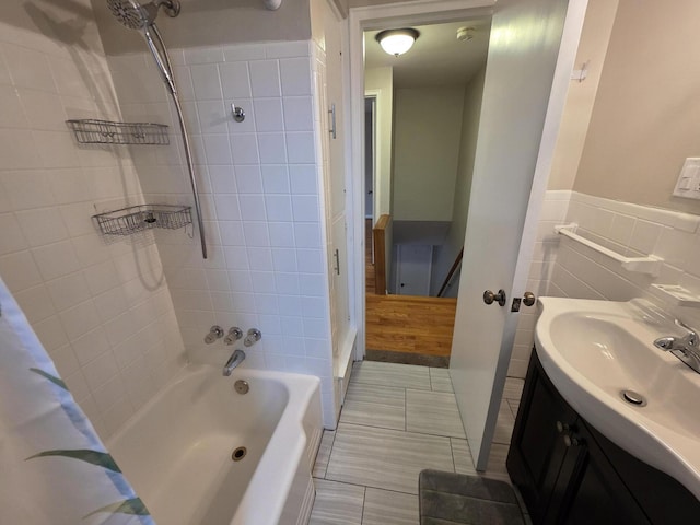 1516 W Webster Rd, Royal Oak, MI 48073 - bathroom featuring shower / tub combo, vanity, tile walls, a wainscoted wall, and tile patterned floors