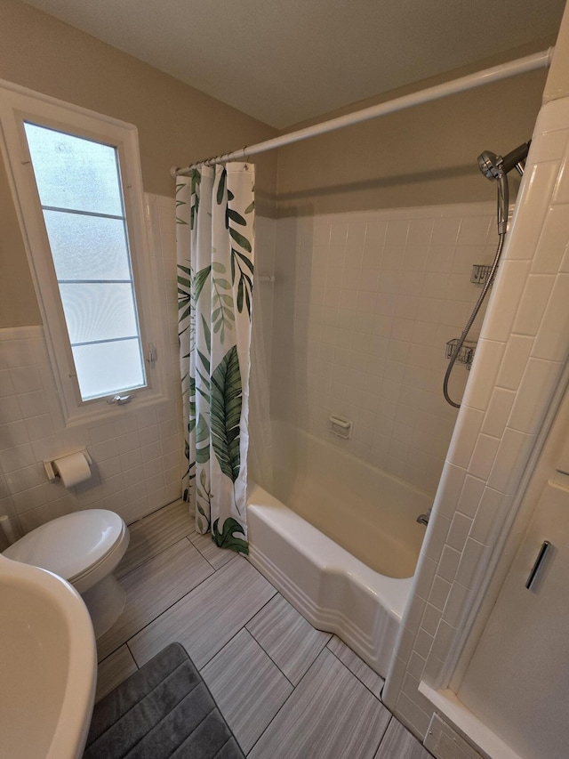 1516 W Webster Rd, Royal Oak, MI 48073 - full bath with tile walls, toilet, shower / bath combination with curtain, a sink, and a wainscoted wall