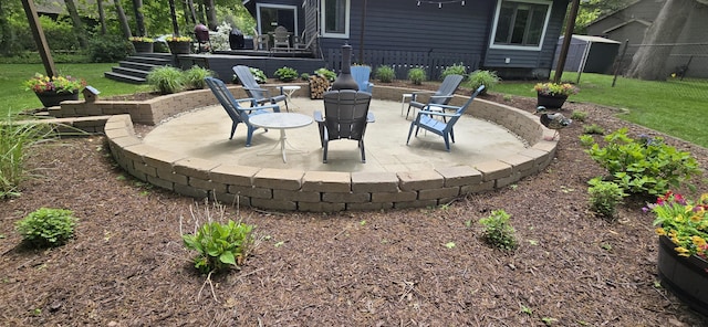 4447 Deer Creek Dr, Norton Shores, MI 49441 - view of patio featuring an outdoor fire pit