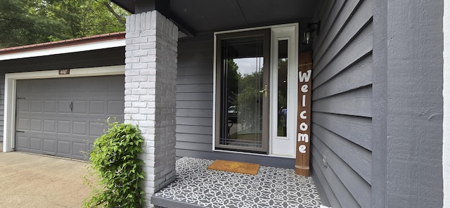 4447 Deer Creek Dr, Norton Shores, MI 49441 - property entrance featuring a garage