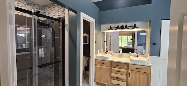 4447 Deer Creek Dr, Norton Shores, MI 49441 - bathroom featuring double vanity, a stall shower, and ensuite bathroom