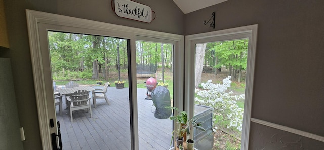 4447 Deer Creek Dr, Norton Shores, MI 49441 - doorway to outside featuring vaulted ceiling