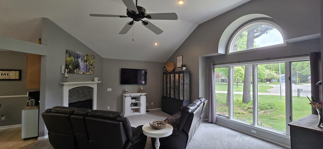 4447 Deer Creek Dr, Norton Shores, MI 49441 - living area featuring healthy amount of natural light, high vaulted ceiling, a ceiling fan, a fireplace, and baseboards