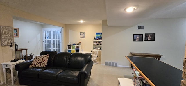 4447 Deer Creek Dr, Norton Shores, MI 49441 - living area with light colored carpet, french doors, and baseboards