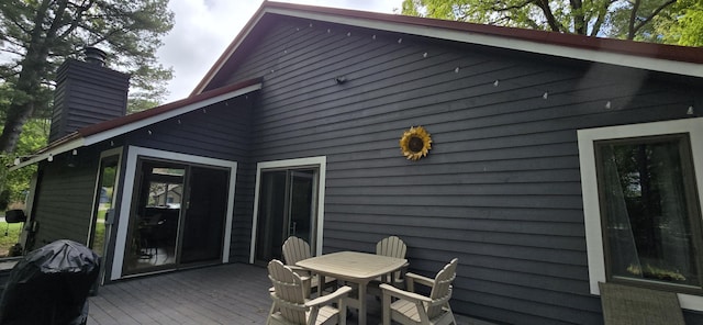 4447 Deer Creek Dr, Norton Shores, MI 49441 - wooden deck with outdoor dining area