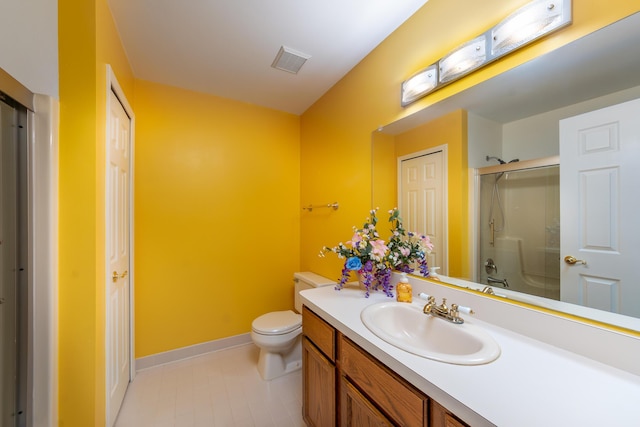 24609 Redwing Dr, Novi, MI 48374 - bathroom featuring an enclosed shower, toilet, vanity, tile patterned flooring, and baseboards