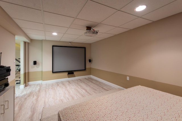 24609 Redwing Dr, Novi, MI 48374 - cinema room featuring a drop ceiling, recessed lighting, light wood-style flooring, and baseboards