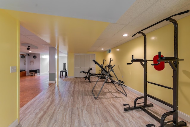 24609 Redwing Dr, Novi, MI 48374 - exercise room featuring a paneled ceiling and baseboards