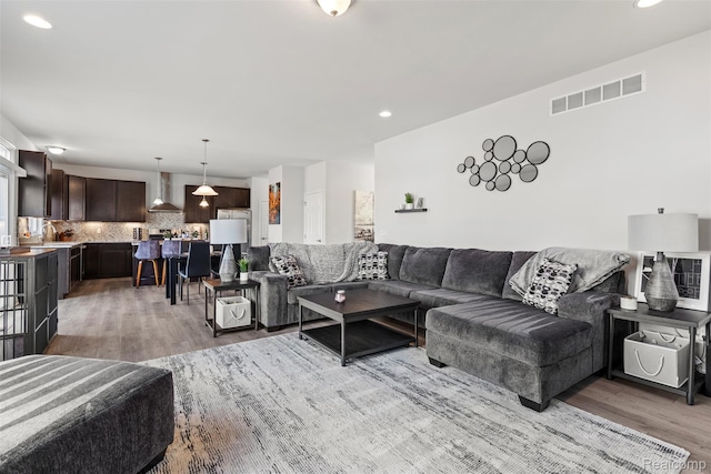 52690 Char Marie, Macomb, MI 48042 - living room with light wood-style floors and recessed lighting