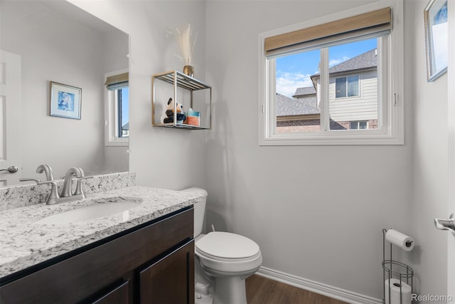 52690 Char Marie, Macomb, MI 48042 - bathroom with toilet, wood finished floors, vanity, and healthy amount of natural light