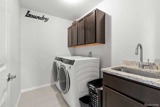 52690 Char Marie, Macomb, MI 48042 - laundry room featuring separate washer and dryer, cabinet space, and baseboards