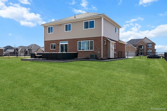 52690 Char Marie, Macomb, MI 48042 - back of house featuring an outdoor hangout area, brick siding, and central AC