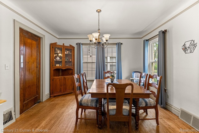 34642 Elm St, Wayne, MI 48184 - dining area with a chandelier and light wood finished floors