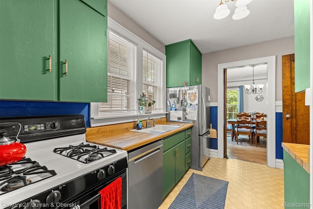34642 Elm St, Wayne, MI 48184 - kitchen featuring stainless steel appliances, a chandelier, light floors, and green cabinets