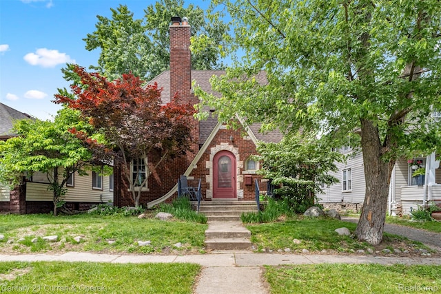 34642 Elm St, Wayne, MI 48184 - view of front of house featuring a chimney, roof with shingles, and brick siding