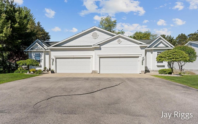 5702 Copper Sands Run Unit 101, Fruitport, MI 49415 - view of front facade with driveway and an attached garage