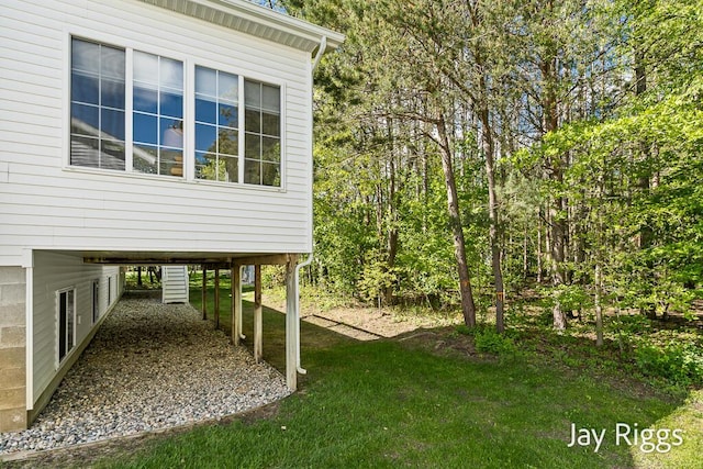 5702 Copper Sands Run Unit 101, Fruitport, MI 49415 - view of green lawn featuring a carport