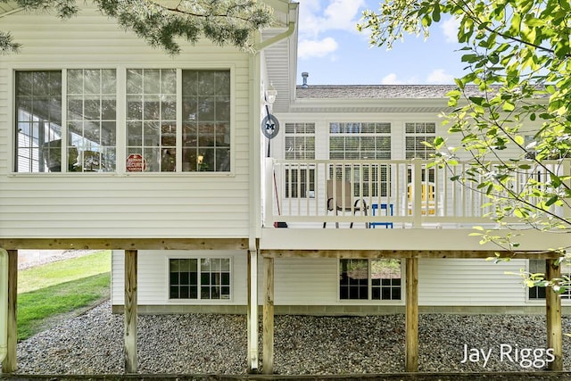 5702 Copper Sands Run Unit 101, Fruitport, MI 49415 - rear view of house with a deck and roof with shingles