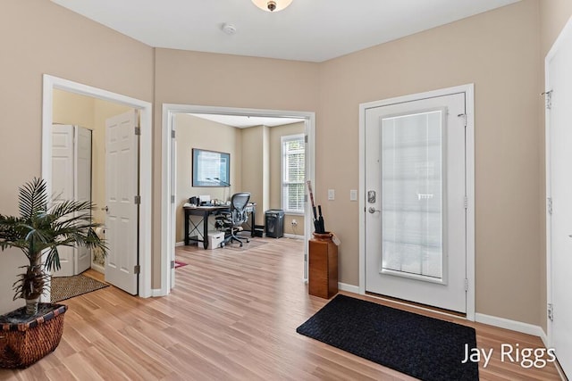 5702 Copper Sands Run Unit 101, Fruitport, MI 49415 - foyer entrance featuring light wood-type flooring and baseboards