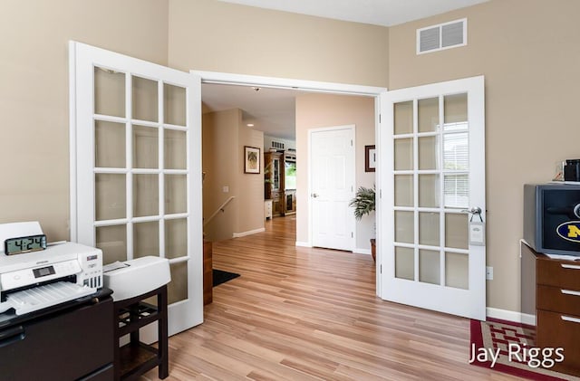 5702 Copper Sands Run Unit 101, Fruitport, MI 49415 - office space featuring light wood-style flooring, baseboards, and french doors
