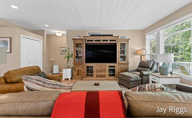 5702 Copper Sands Run Unit 101, Fruitport, MI 49415 - living area with wood finished floors and recessed lighting