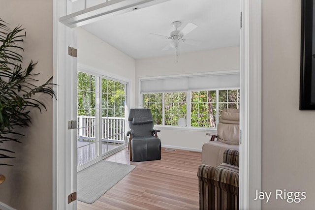 5702 Copper Sands Run Unit 101, Fruitport, MI 49415 - sitting room with a ceiling fan, wood finished floors, and baseboards