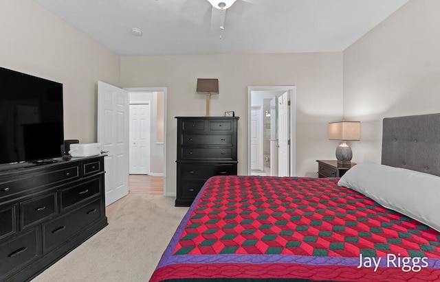5702 Copper Sands Run Unit 101, Fruitport, MI 49415 - bedroom featuring light colored carpet and connected bathroom