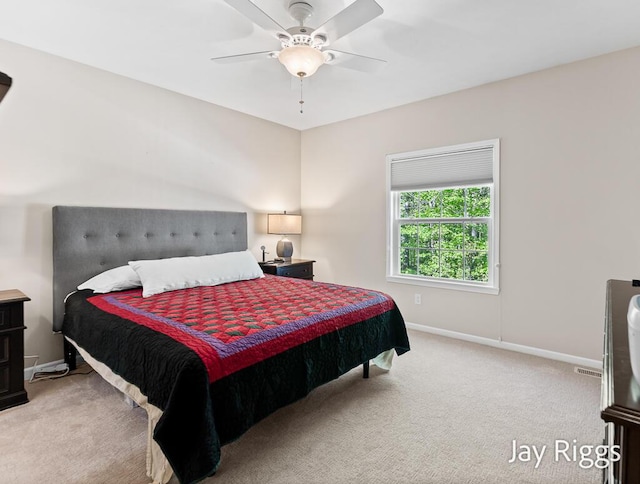 5702 Copper Sands Run Unit 101, Fruitport, MI 49415 - bedroom with carpet floors, baseboards, and ceiling fan