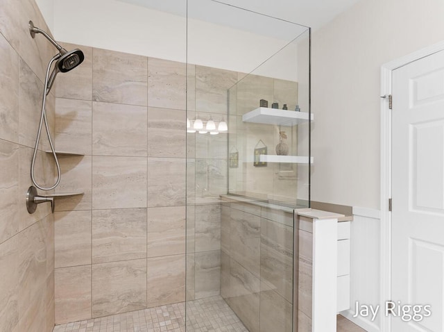 5702 Copper Sands Run Unit 101, Fruitport, MI 49415 - full bathroom featuring a shower stall and wainscoting