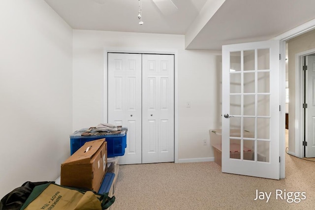 5702 Copper Sands Run Unit 101, Fruitport, MI 49415 - unfurnished bedroom featuring a closet, baseboards, and carpet