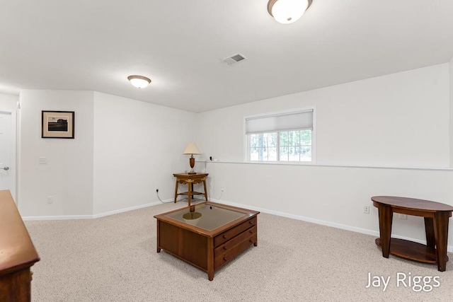 5702 Copper Sands Run Unit 101, Fruitport, MI 49415 - sitting room featuring baseboards and light colored carpet