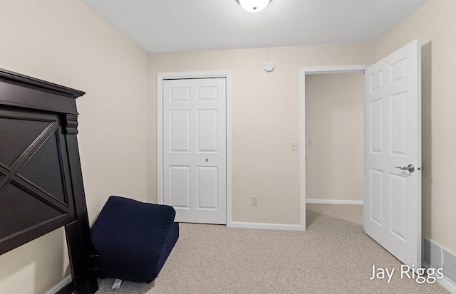 5702 Copper Sands Run Unit 101, Fruitport, MI 49415 - bedroom featuring carpet floors, baseboards, and a closet