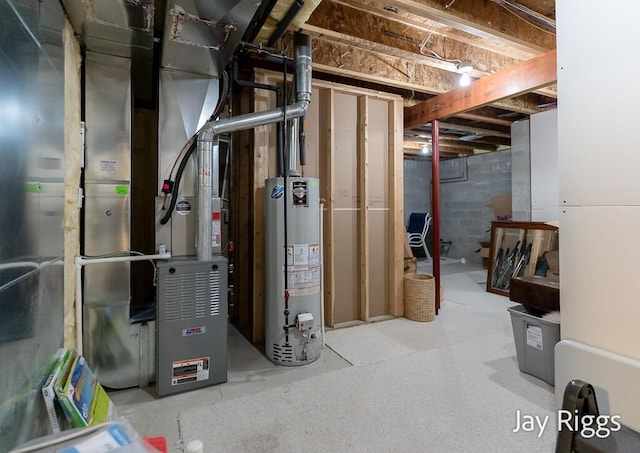 5702 Copper Sands Run Unit 101, Fruitport, MI 49415 - unfinished below grade area featuring water heater and heating unit