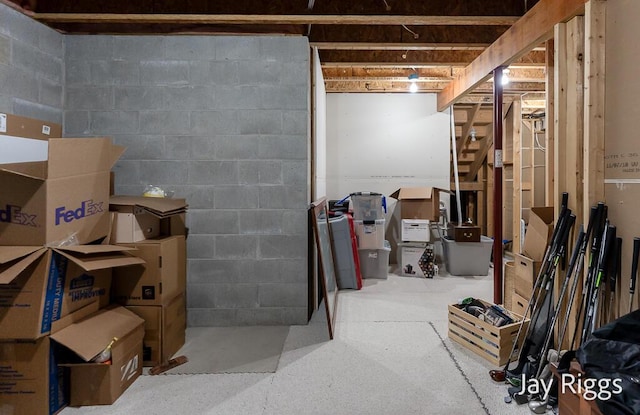 5702 Copper Sands Run Unit 101, Fruitport, MI 49415 - unfinished basement with stairs and concrete block wall