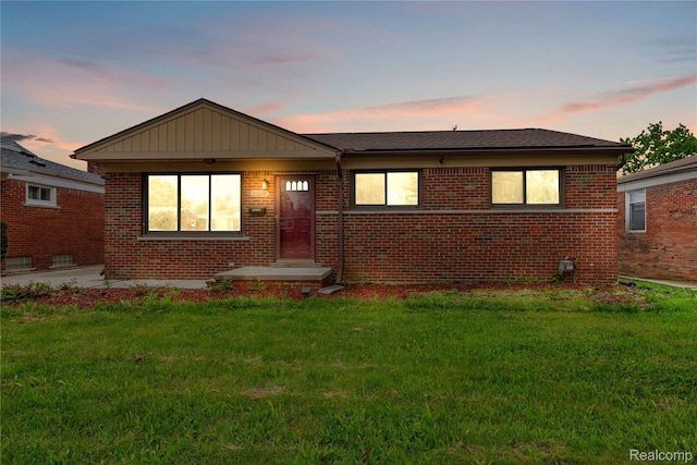 21608 Barton St, Saint Clair Shores, MI 48081 - view of front of home with brick siding and a yard
