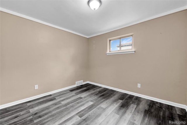 21608 Barton St, Saint Clair Shores, MI 48081 - empty room with baseboards, dark wood-type flooring, and crown molding