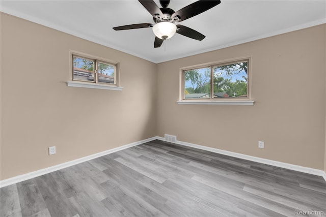 21608 Barton St, Saint Clair Shores, MI 48081 - unfurnished room featuring healthy amount of natural light, ceiling fan, baseboards, and ornamental molding