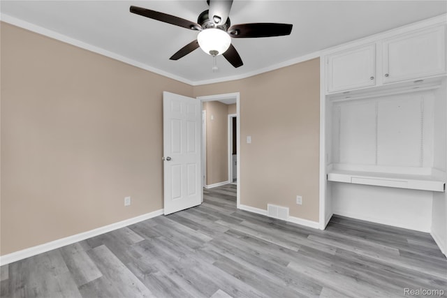 21608 Barton St, Saint Clair Shores, MI 48081 - unfurnished bedroom with a closet, light wood-style floors, baseboards, a ceiling fan, and ornamental molding