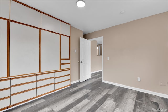 21608 Barton St, Saint Clair Shores, MI 48081 - empty room with dark wood-type flooring and baseboards