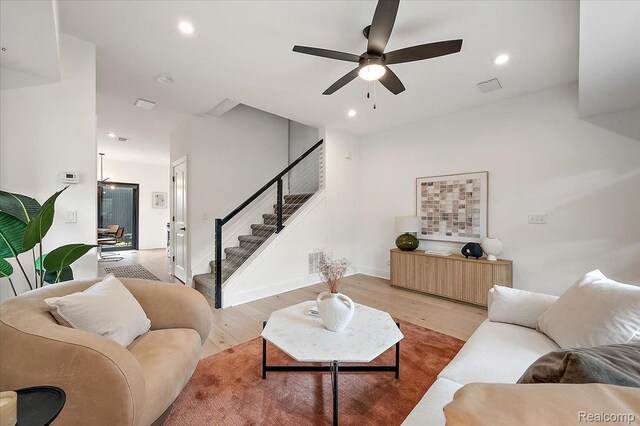 3303 Cochrane, Detroit, MI 48208 - living area featuring light wood-style floors, stairway, ceiling fan, and recessed lighting