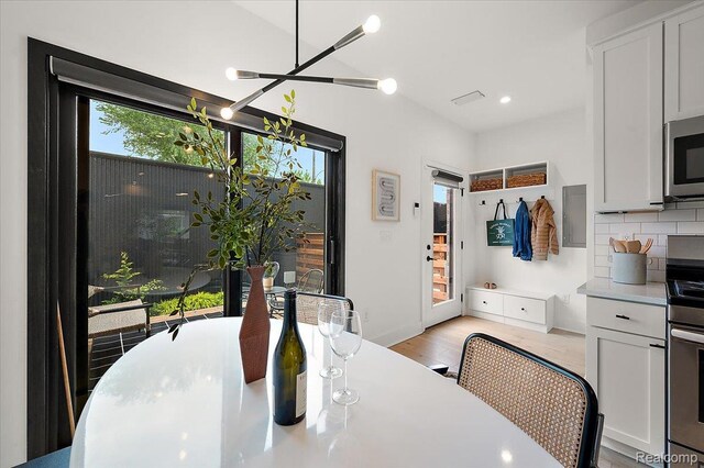 3303 Cochrane, Detroit, MI 48208 - dining room featuring a chandelier, light wood-type flooring, and recessed lighting