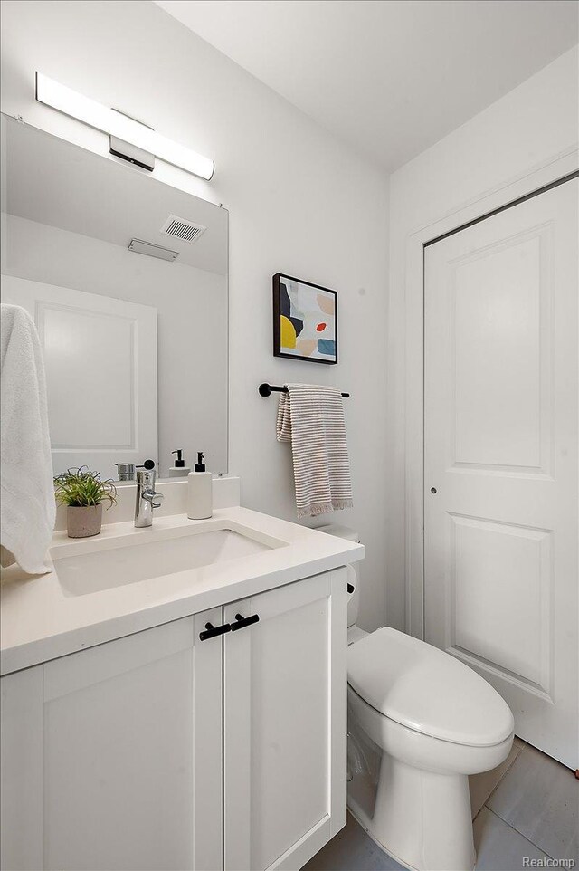 3303 Cochrane, Detroit, MI 48208 - half bathroom featuring vanity and toilet