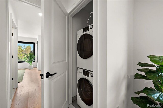 3303 Cochrane, Detroit, MI 48208 - laundry area featuring estacked washer and dryer and light wood-type flooring