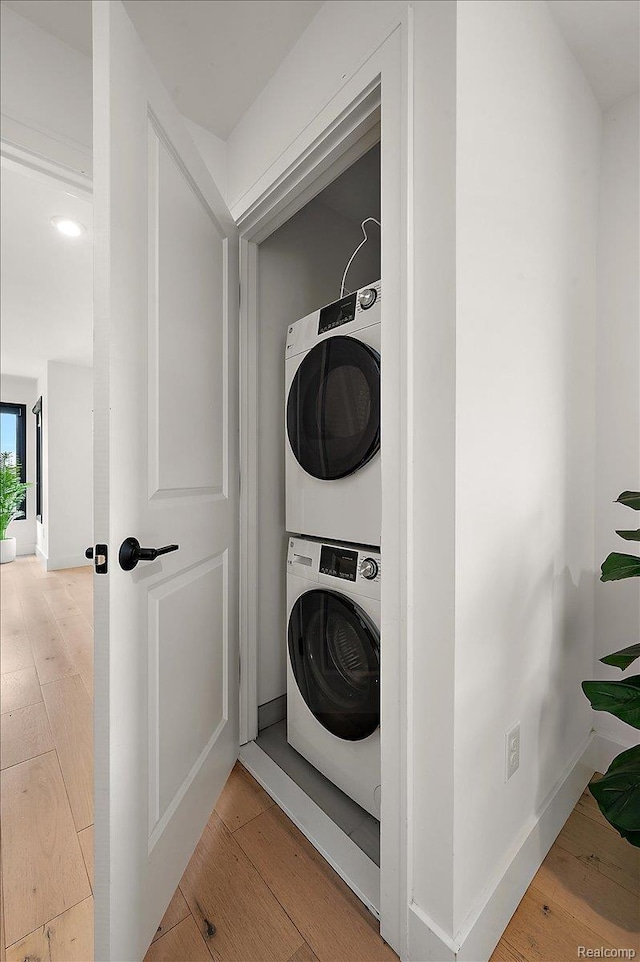 3303 Cochrane, Detroit, MI 48208 - laundry room featuring stacked washer / dryer and hardwood / wood-style flooring