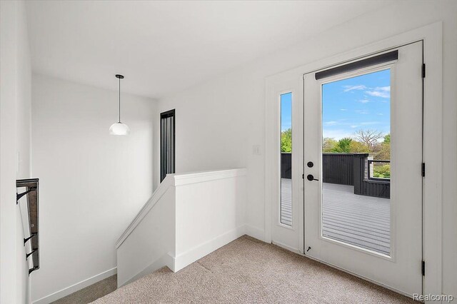3303 Cochrane, Detroit, MI 48208 - doorway to outside with light colored carpet and baseboards