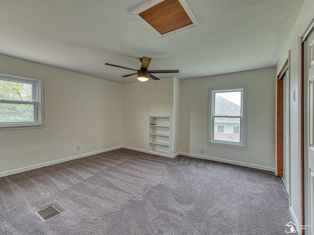 22933 Monterey Dr, Woodhaven, MI 48183 - unfurnished bedroom with attic access, carpet flooring, baseboards, and ceiling fan