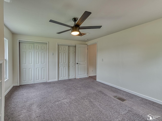 22933 Monterey Dr, Woodhaven, MI 48183 - unfurnished bedroom with multiple closets, carpet floors, and baseboards