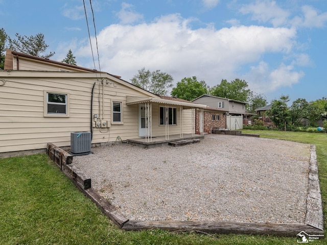 22933 Monterey Dr, Woodhaven, MI 48183 - back of house with a lawn and central AC