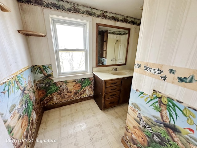 5207 S Whiteville Rd, Mount Pleasant, MI 48858 - bathroom featuring tile patterned floors, vanity, and wallpapered walls